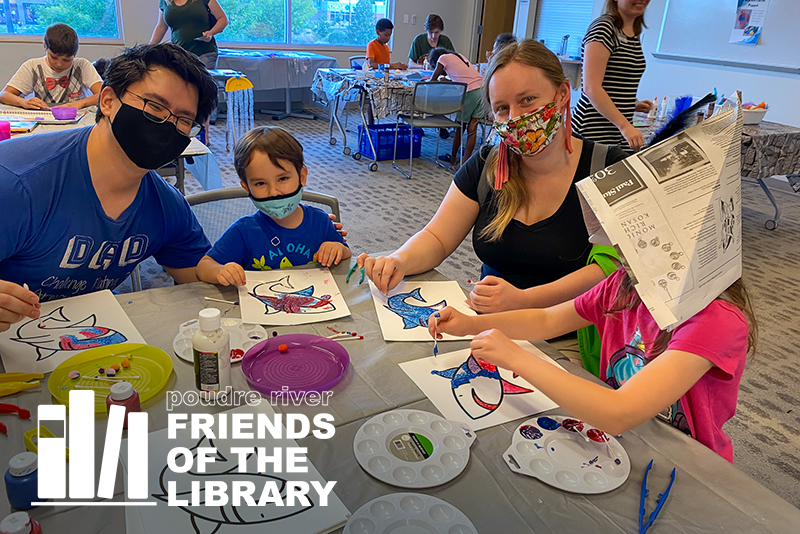 A family at a crafts program at the library
