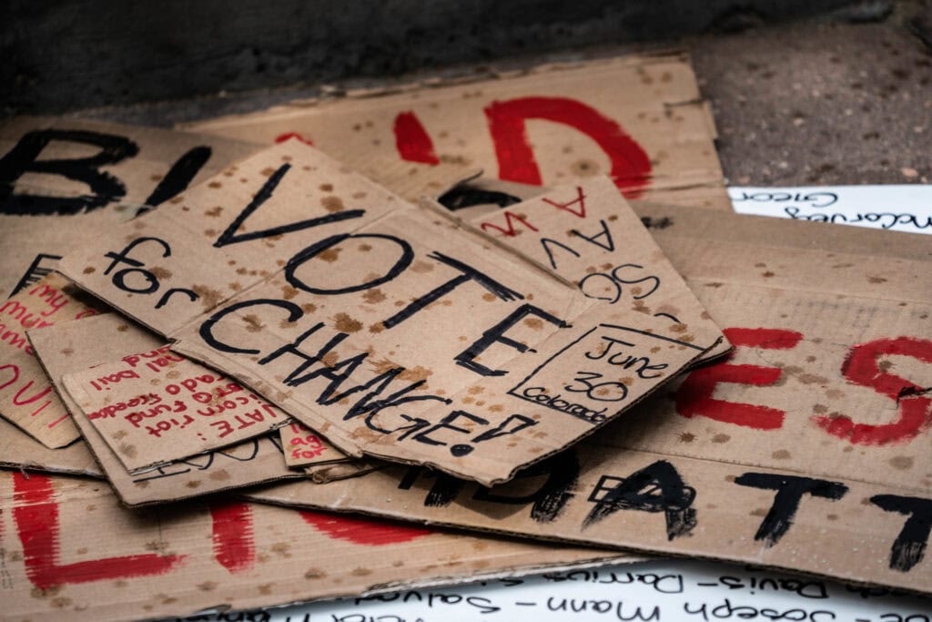 black lives matter protest signs on the ground