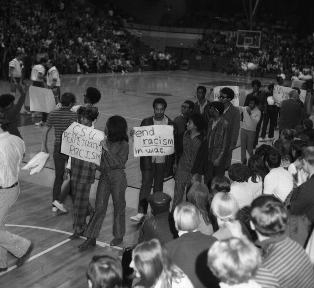 students protest at a basketball game at Colorado State University