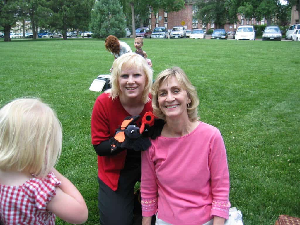 woman and her sister smiling for a photo