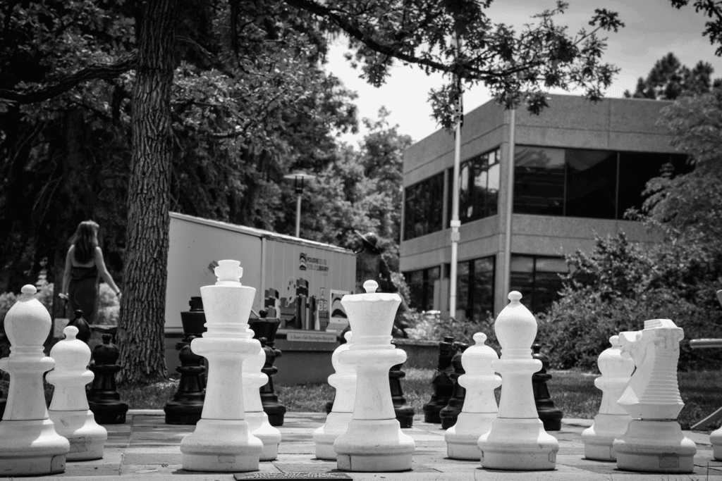 giant chess set outside a library