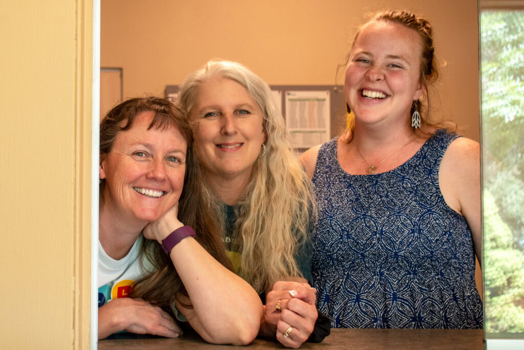 Three women smiling for a photo