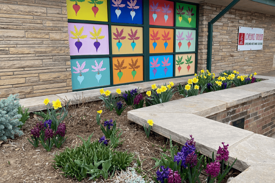 A colorful mural on the exterior of the Loveland Museum