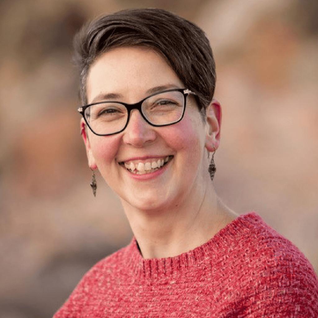 smiling woman with short brown hair