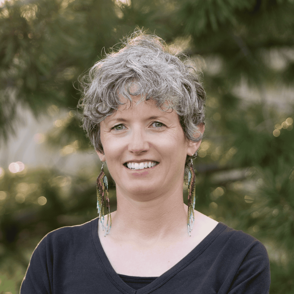 smiling woman with and short gray hair