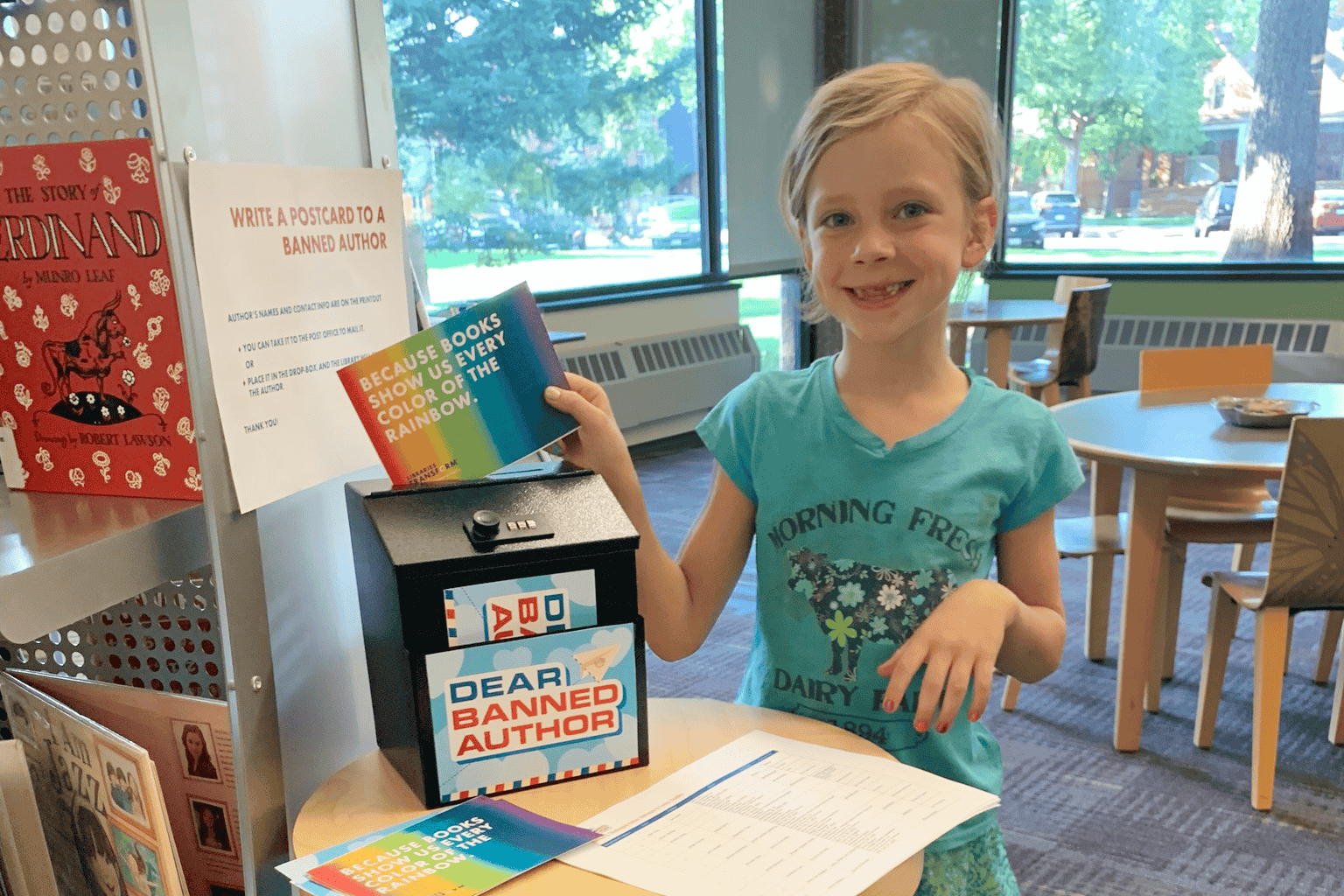 Young girl putting a letter to a banned author in a box