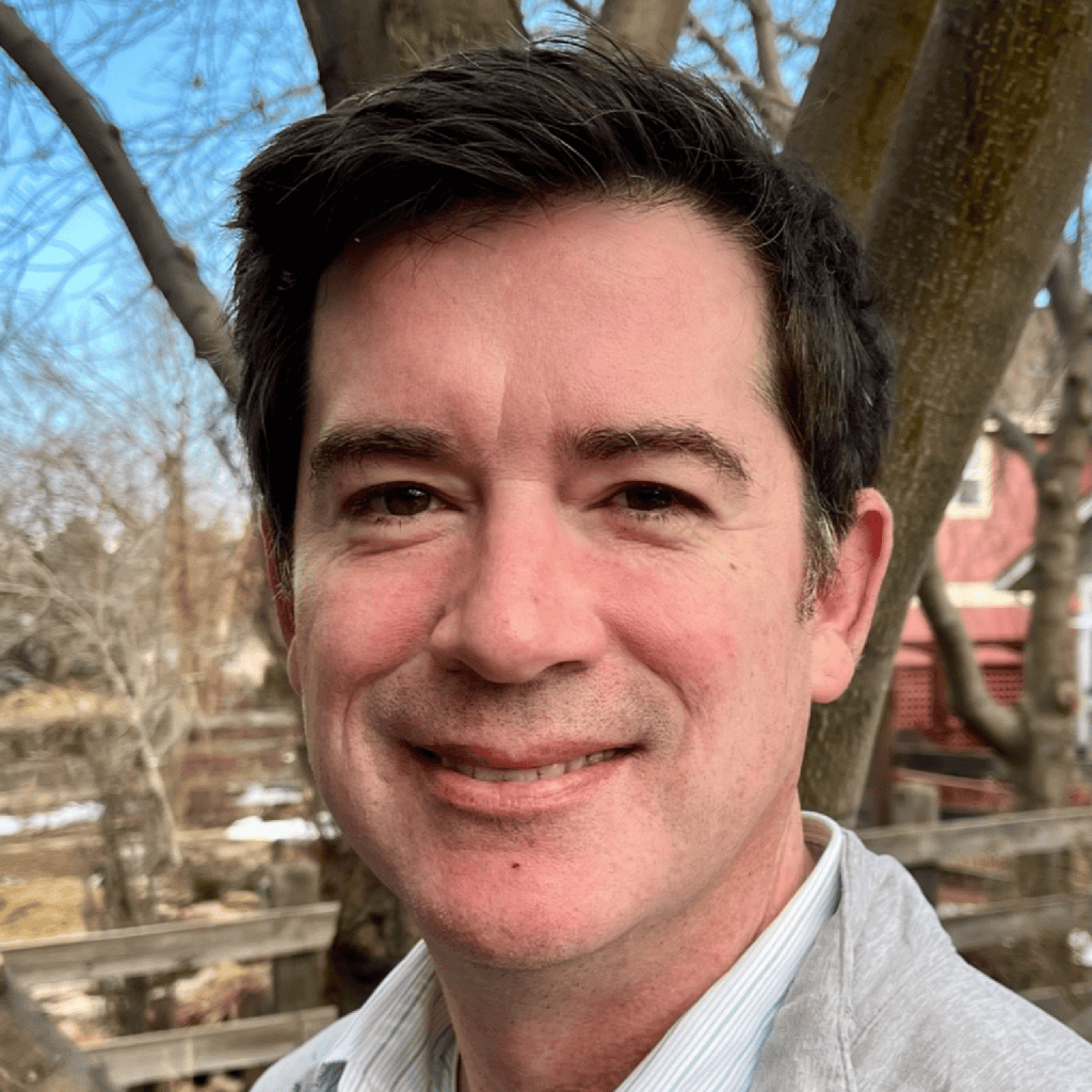 smiling man with short brown hair