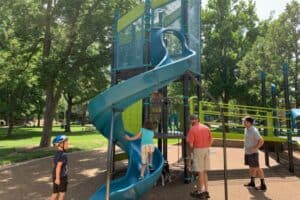 Children and adults exploring a playground