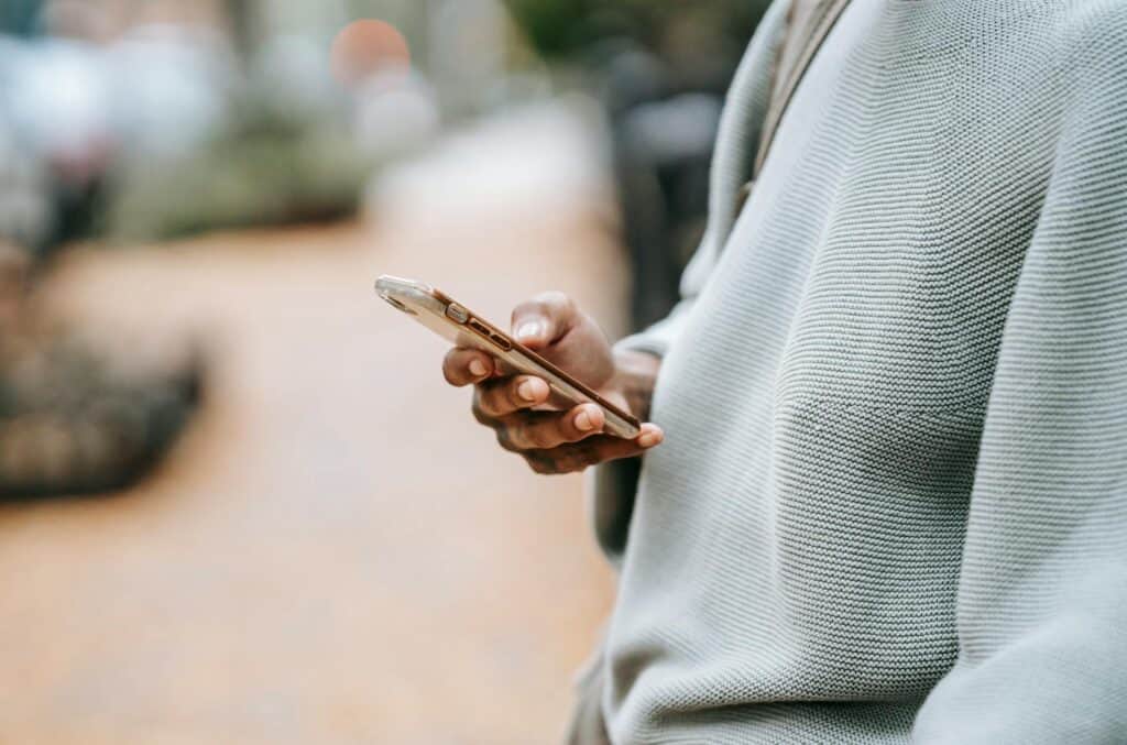 hand holding out a smartphone