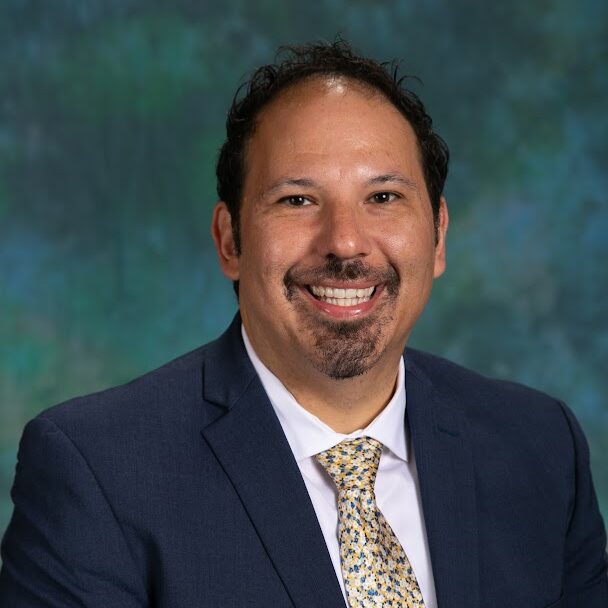 man smiling for a professional headshot