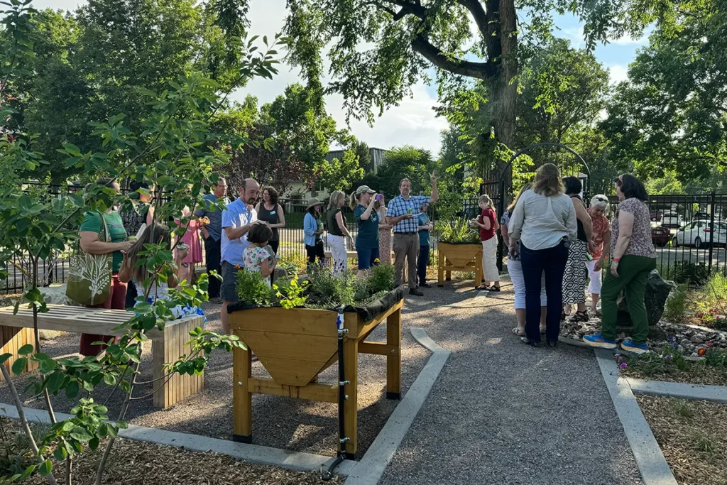 group of people socializing in a garden