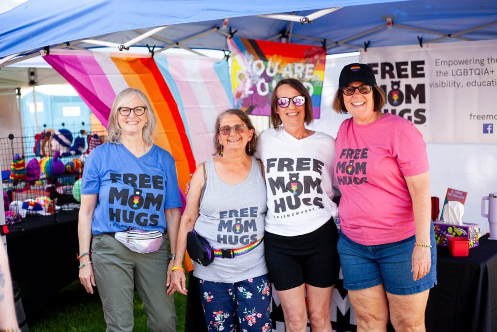 four women smiling for a photo