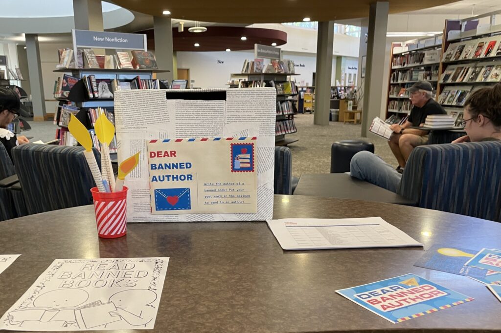 table with materials for writing letters to banned authors