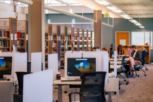 computers at bookshelves at harmony library