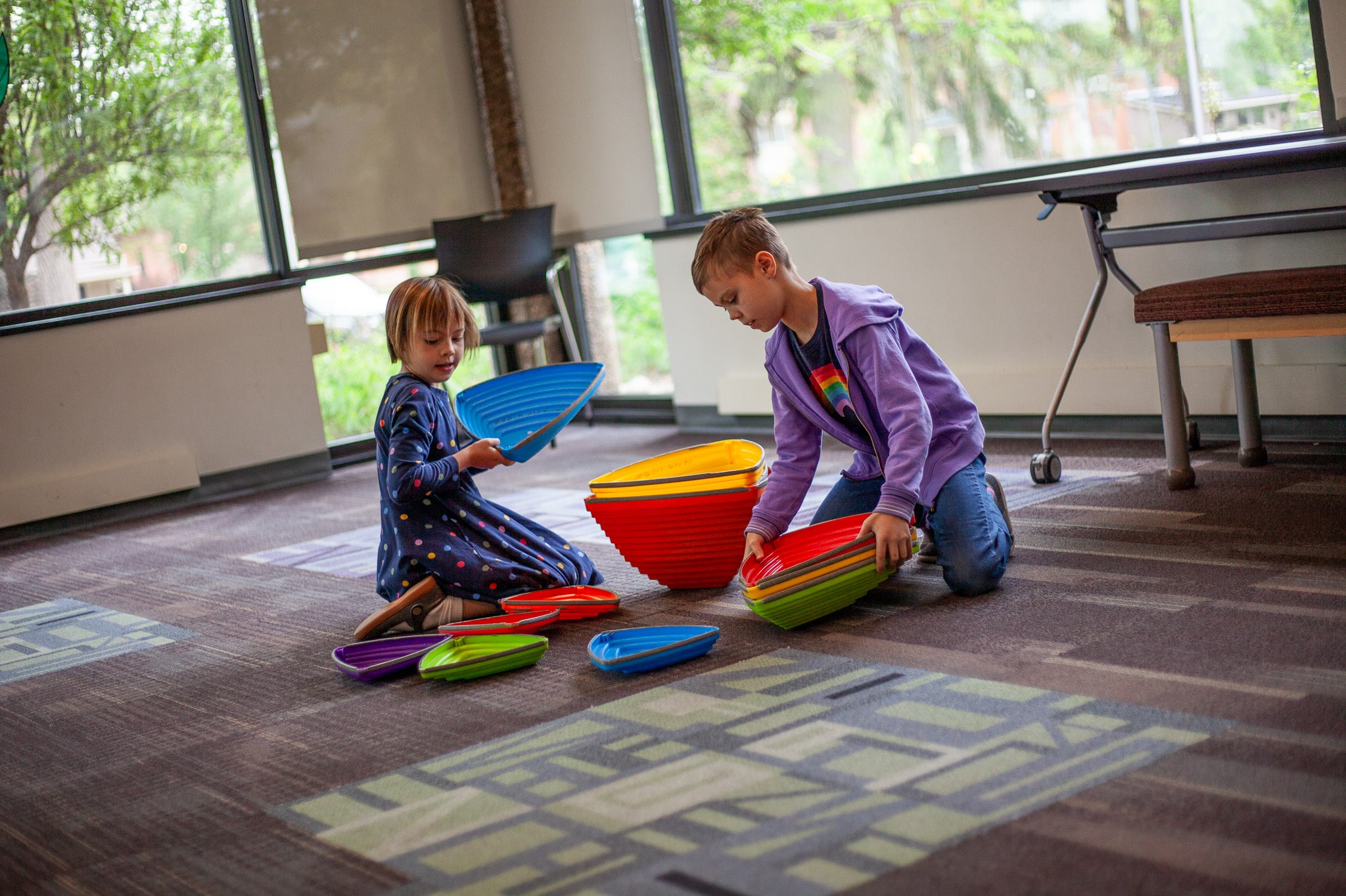 two young girls playing in a library