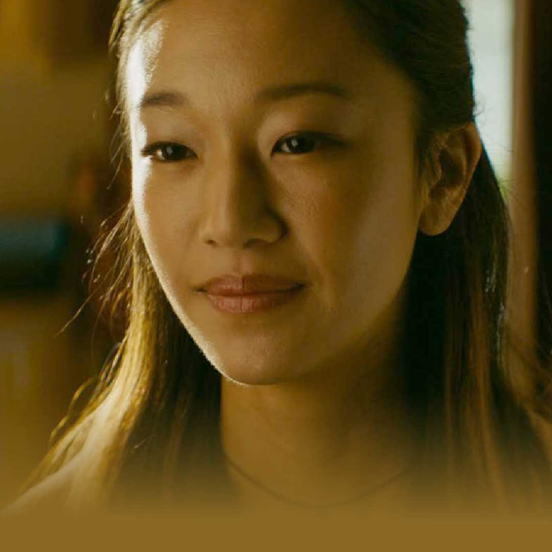 close up of an east asian woman's smiling face